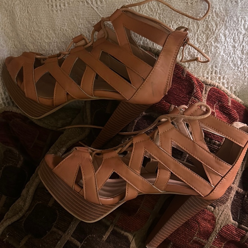 Worn twice. Heel was just too high got me. I’m clumsy. I’ve had them forever.